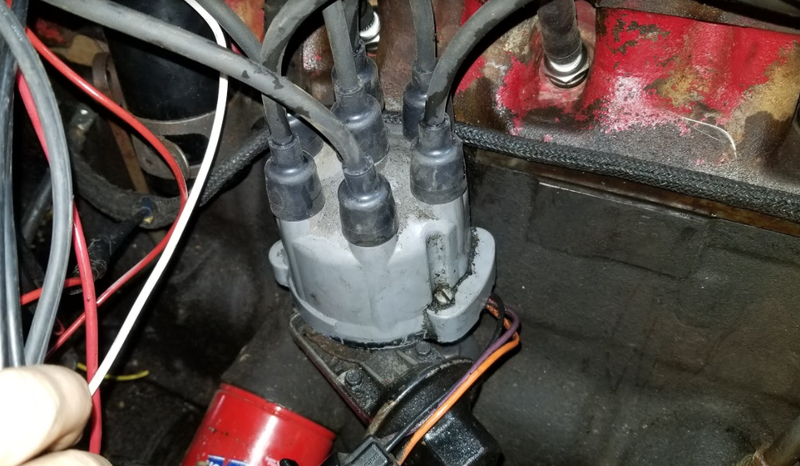 The rotor under the cap is pointed towards the rightmost spark plug wire (that goes to cylinder one)